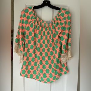 Ladies top size medium green and orange geo print.  Loose fit